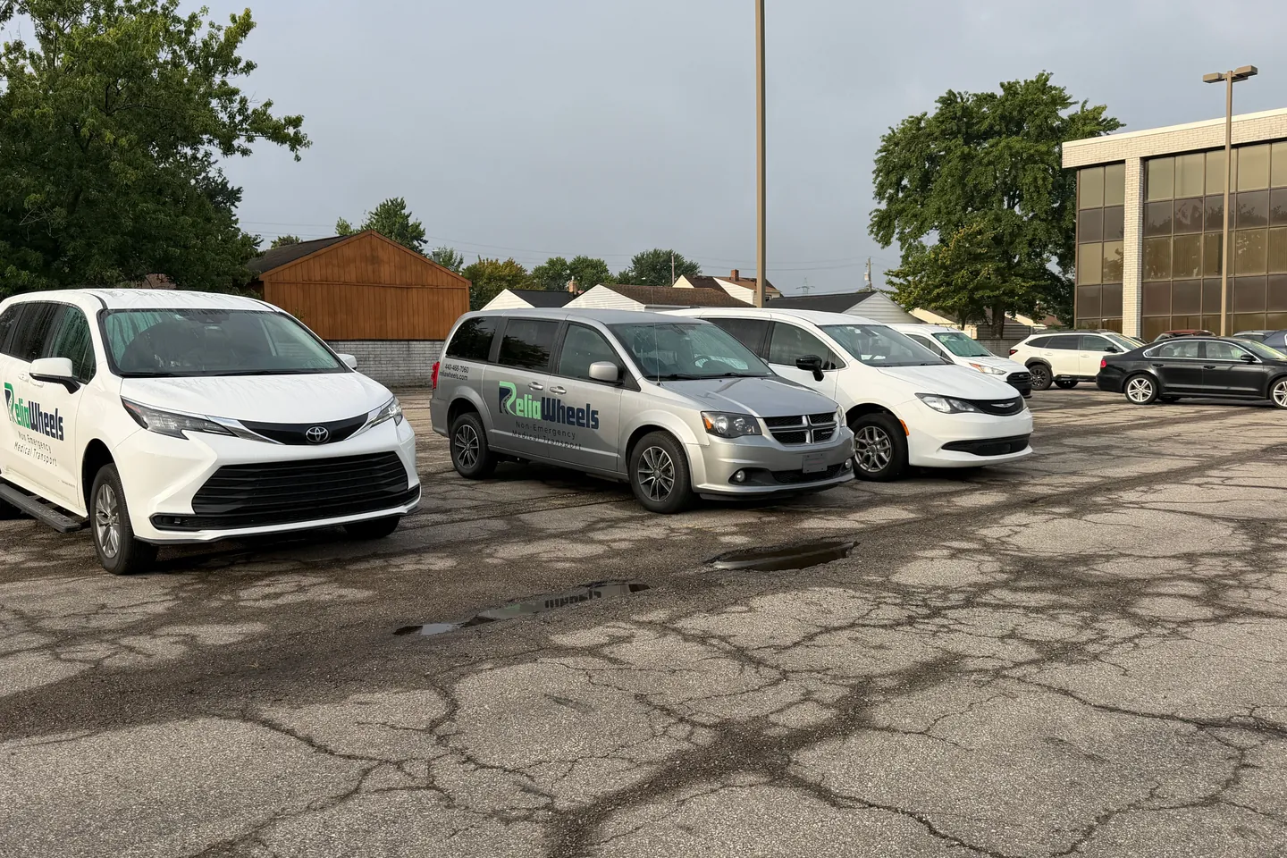 ReliaWheels wheelchair vans and a minivan parked side by side in a lot