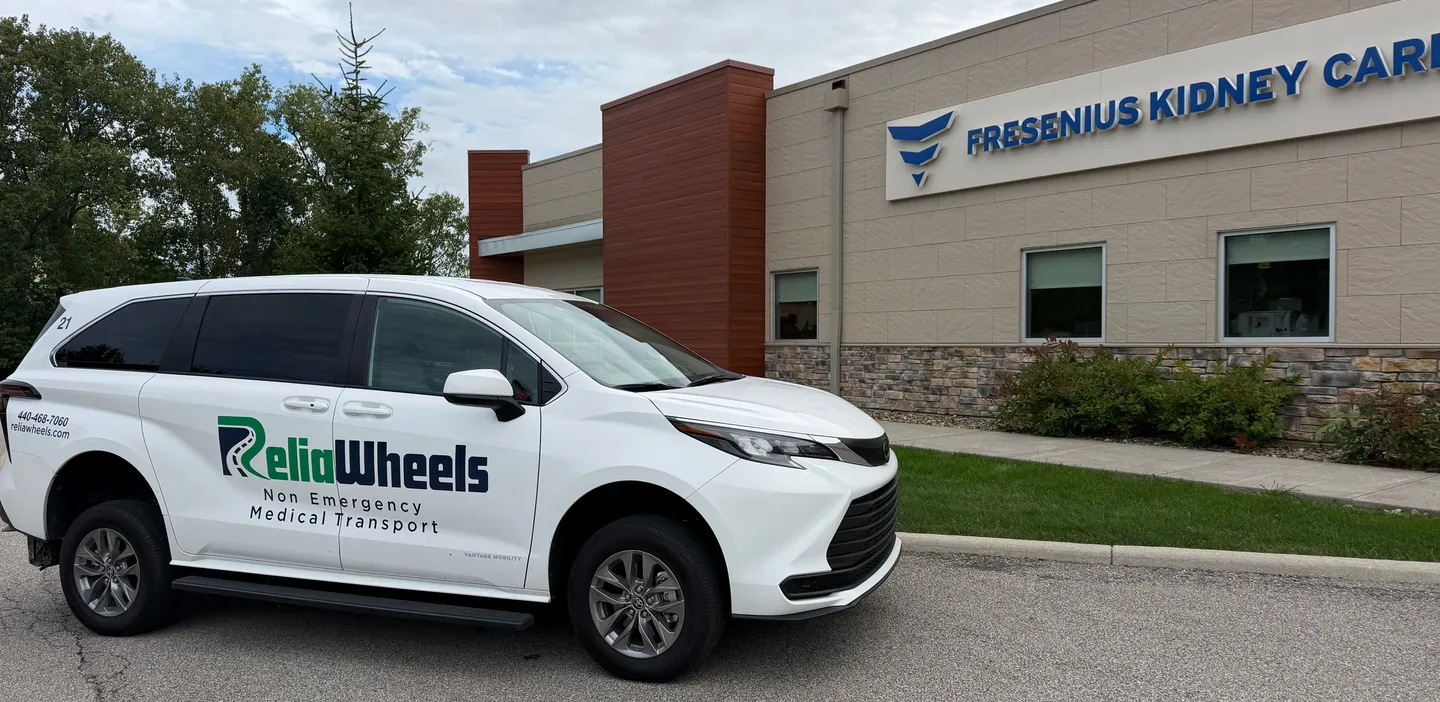 A ReliaWheels wheelchair van parked outside a Fresenius Kidney Care center